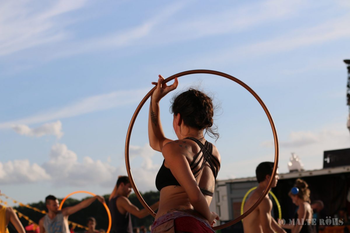 Woman playing hula hoop during the European Juggling Convention (EJC) 2016 in Almere, Netherlands